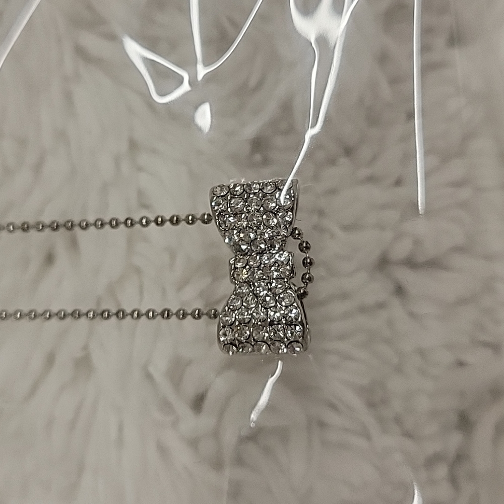 Absolutely adorable pave rhinestone bow on the middle of a tiny ball chain !!